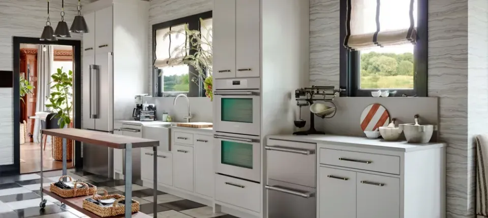 luxury appliances set in a modern kitchen with white cabinets